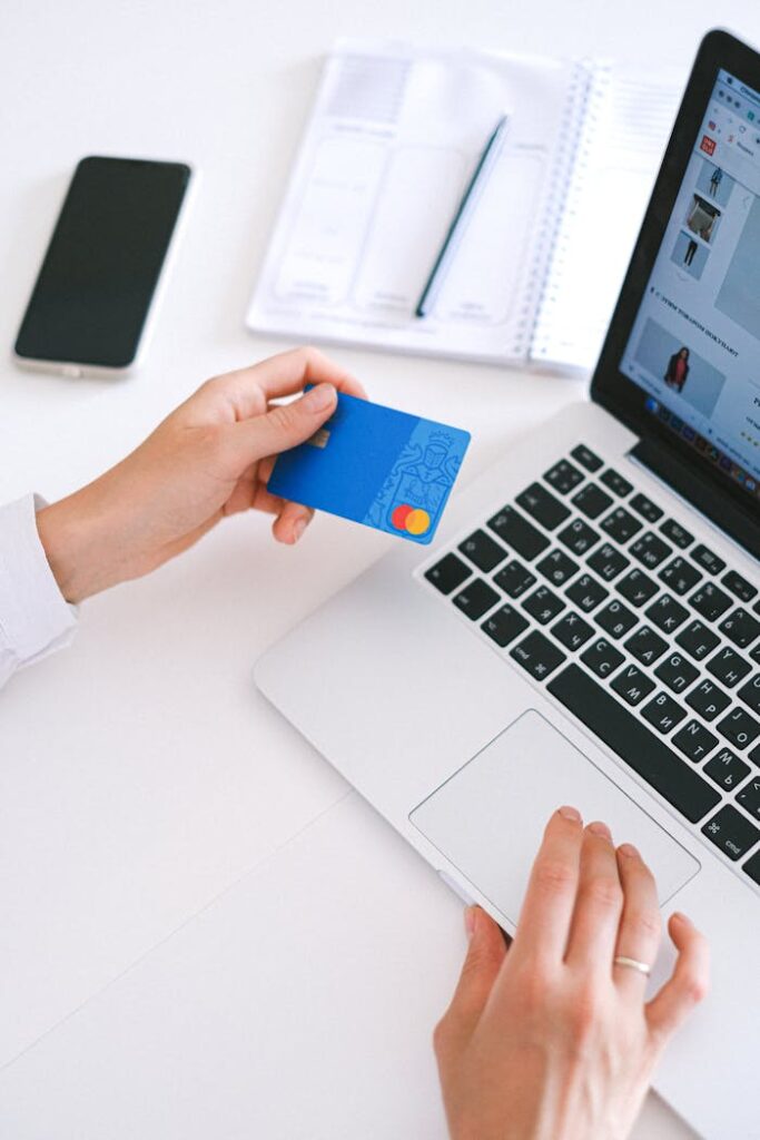 Person Holding Bank Card